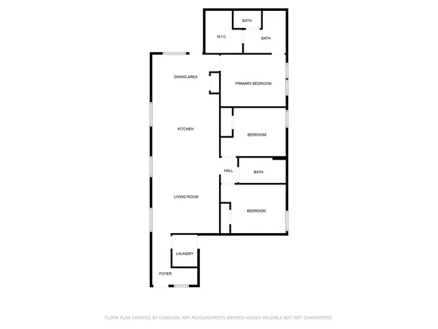 a picture of a bench in front of a wall