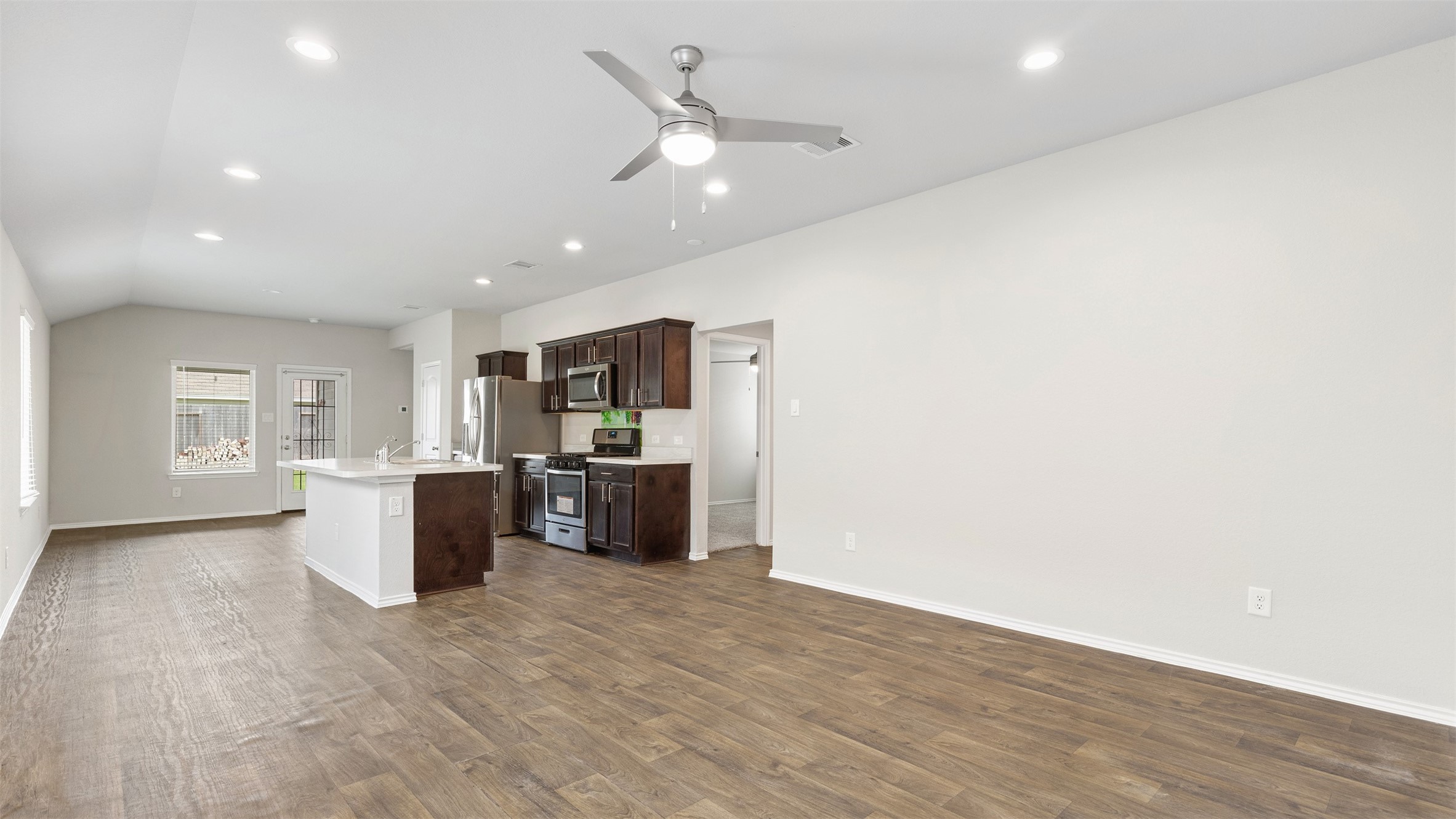 2311 Silver Plume Lane Spring, TX 77373 - Photo 6 of 24 a view of a kitchen with a sink and a refrigerator