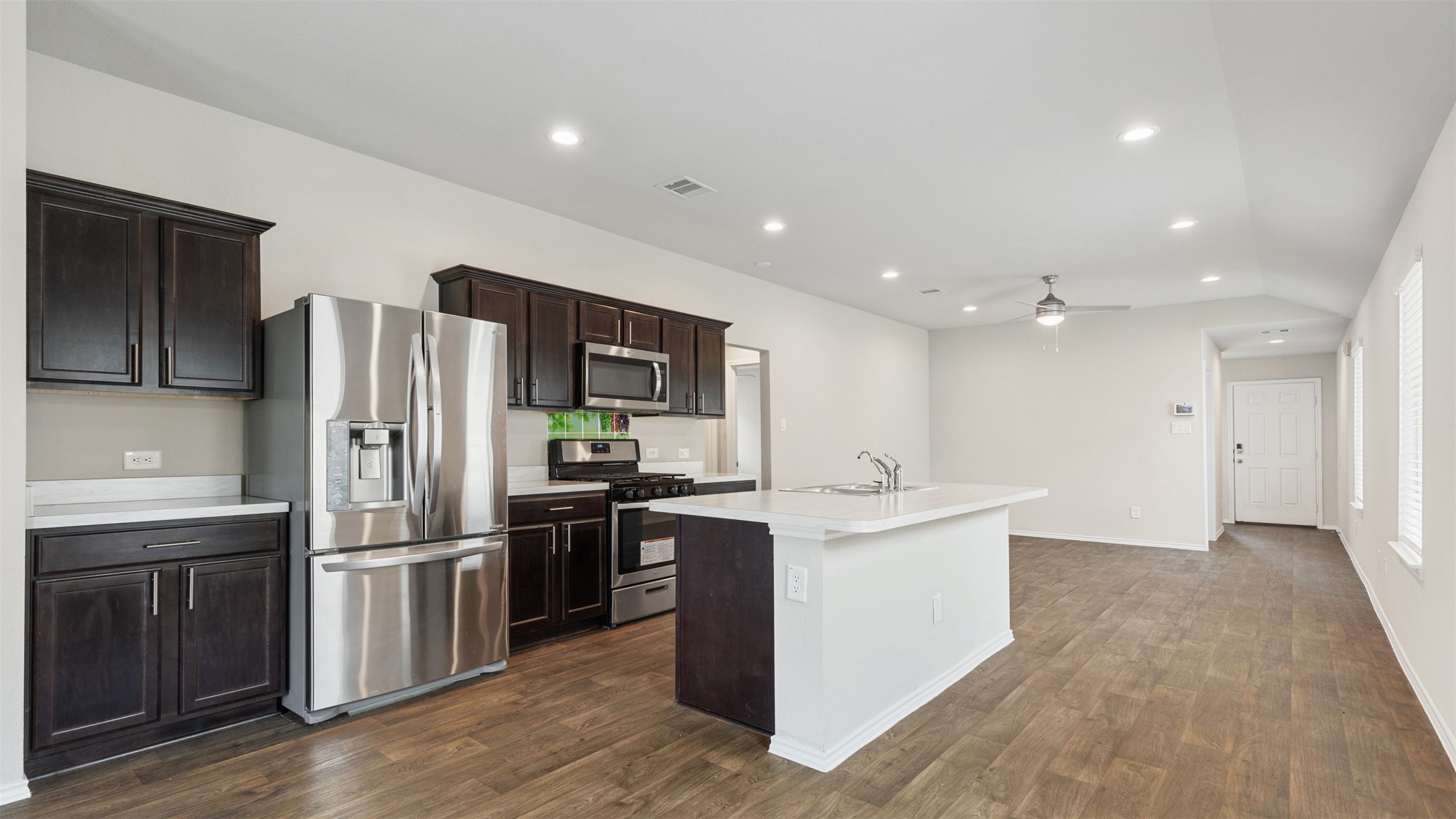 2311 Silver Plume Lane Spring, TX 77373 - Photo 8 of 24 a kitchen with stainless steel appliances granite countertop a refrigerator and a sink