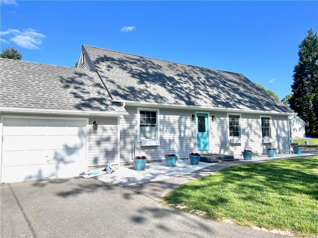 75 Bayview Road East Lyme, CT 06357 - Photo 1 of 1 a front view of a house with a garden and patio