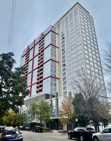 a front view of a building and trees