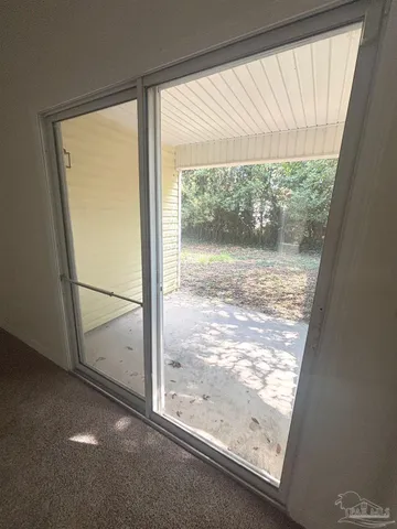 a view of a room with a large window