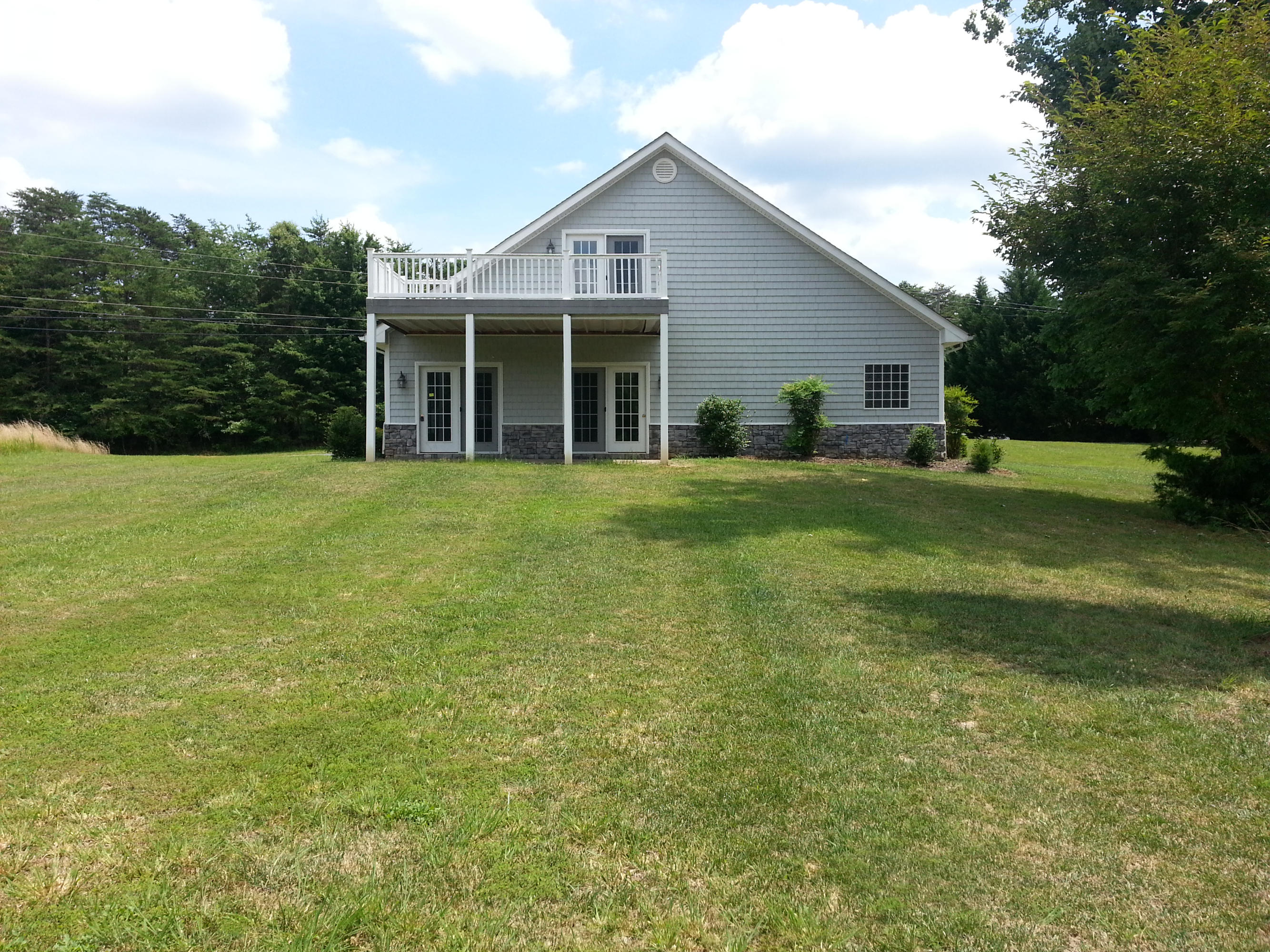 2463 Dillards Hill Road Union Hall, VA 24176 - Photo 2 of 14 a front view of a house with a garden