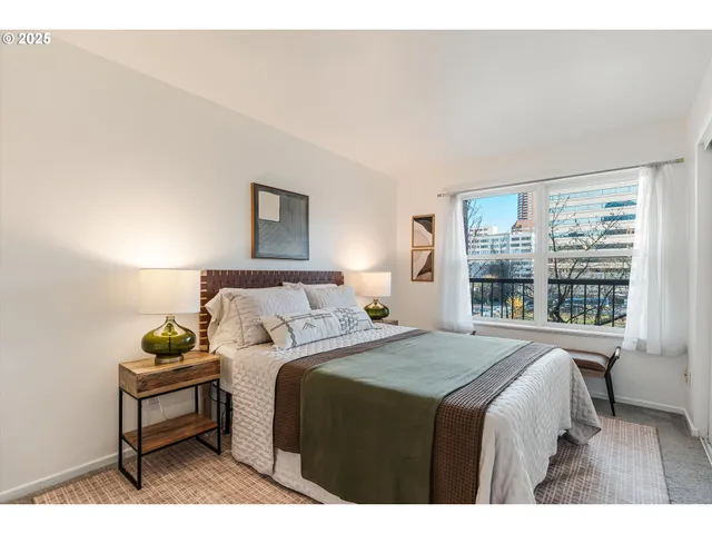 a bedroom with a bed and a window