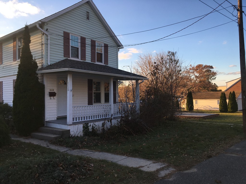 2338 Main Street Three Rivers, MA 01080 - Photo 3 of 22 a front view of a house with a garden