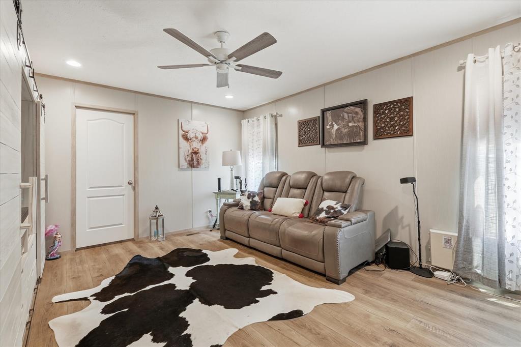 193 Firefly Drive Springtown, TX 76082 - Photo 20 of 32 Spacious living area featuring wood-finish flooring, recessed lighting, and a ceiling fan