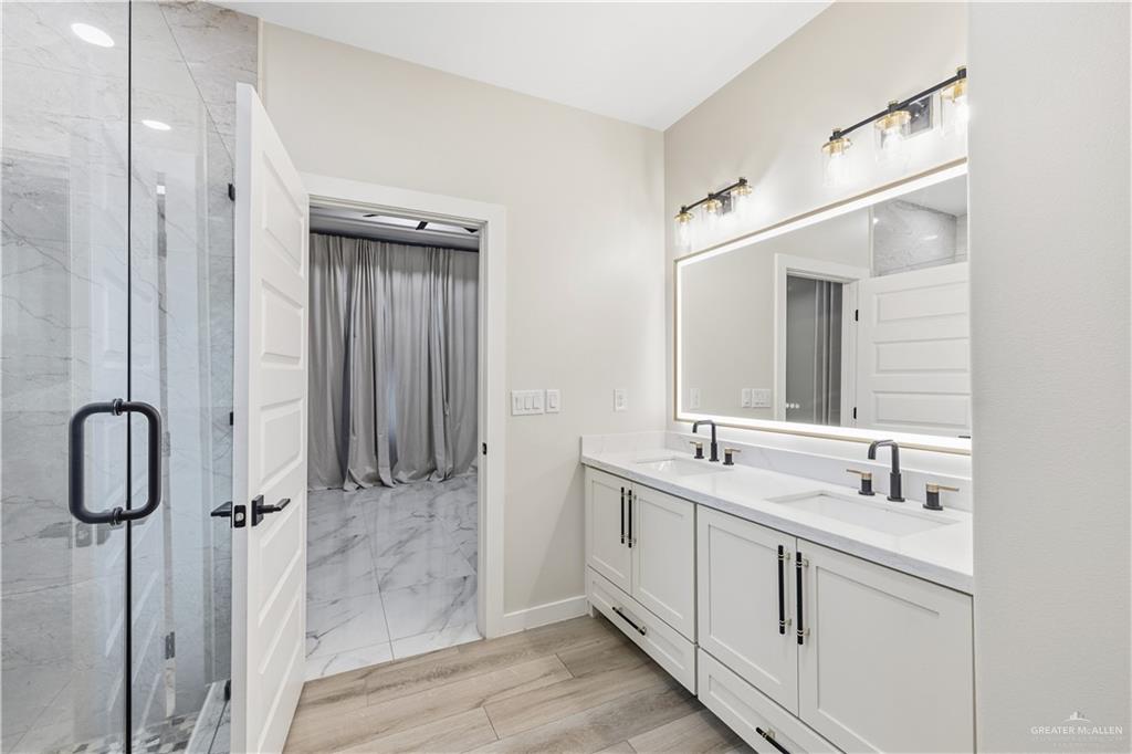 3509 Astrid Street Mission, TX 78574 - Photo 24 of 30 a bathroom with a double vanity sink mirror and double