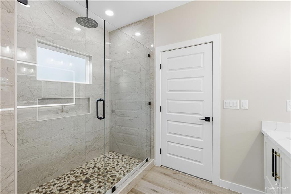 3509 Astrid Street Mission, TX 78574 - Photo 25 of 30 a bathroom with a shower and a sink