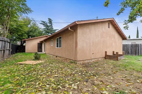a backyard of a house with lots of green space