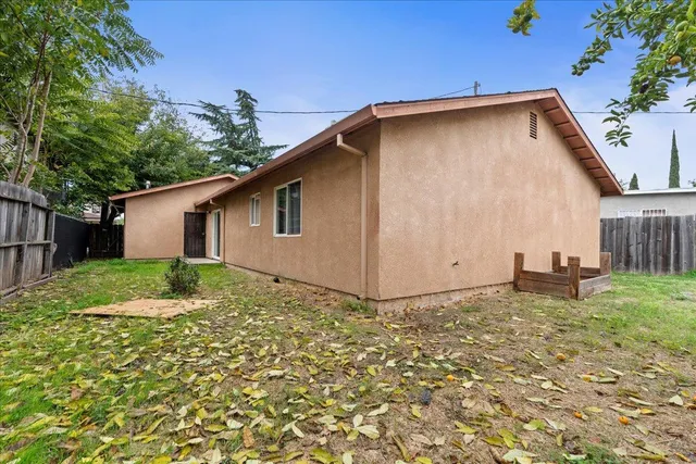 a backyard of a house with lots of green space