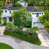 a view of a big house with a yard