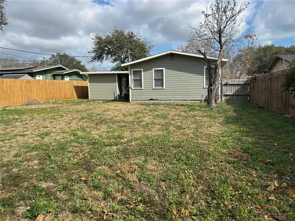 a house with trees in the background