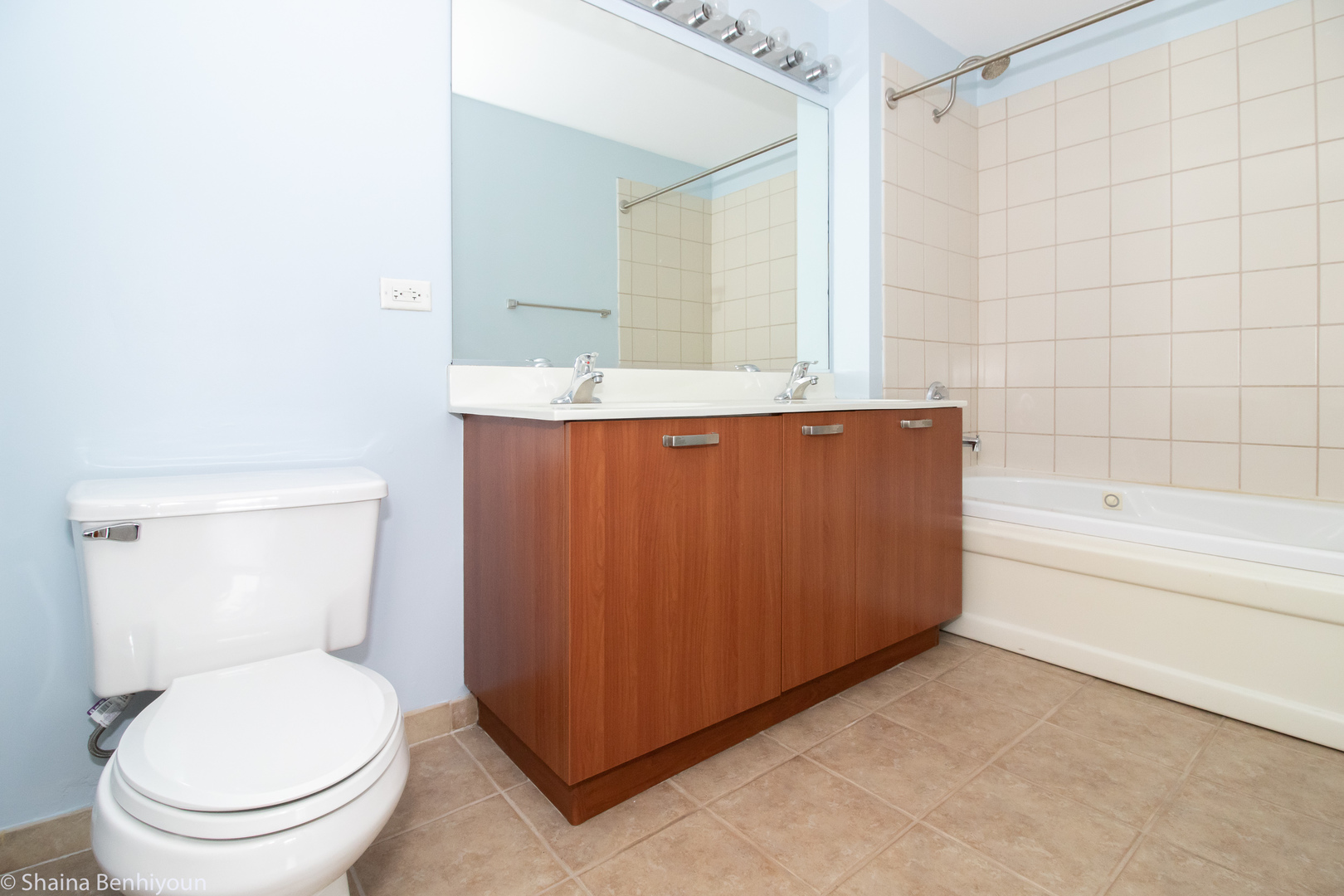 111 South Morgan Street, Unit 715 Chicago, IL 60607 - Photo 4 of 17 a bathroom with a granite countertop toilet a sink and bathtub
