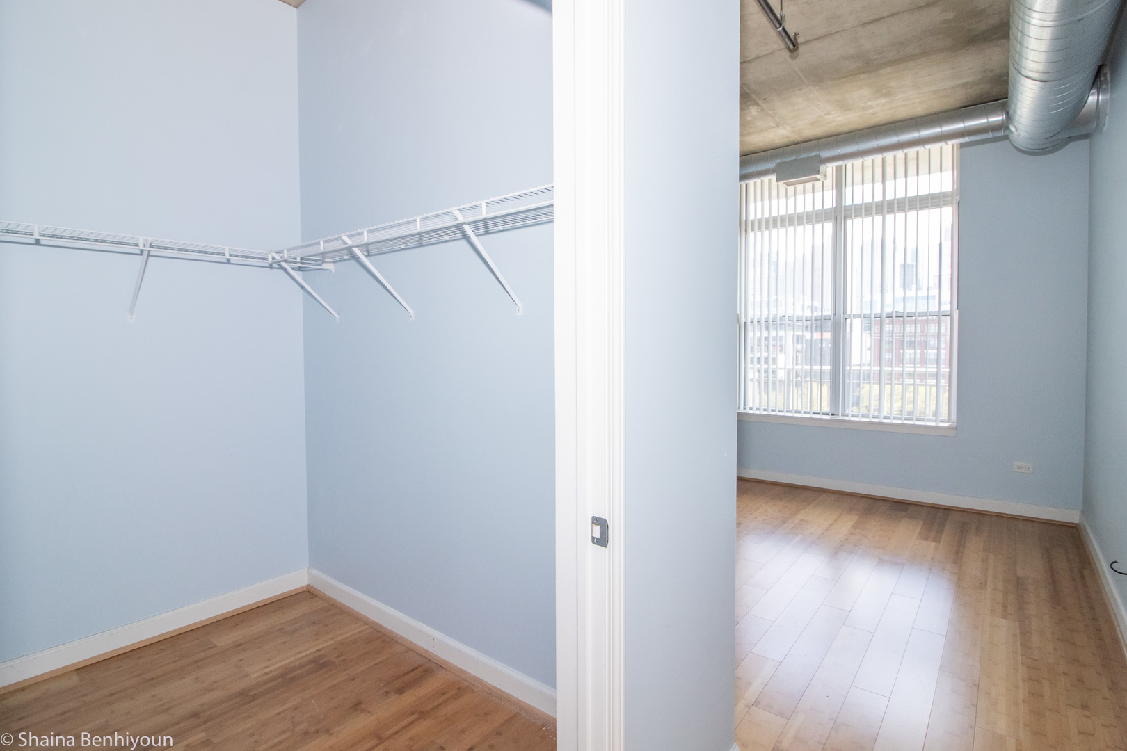 111 South Morgan Street, Unit 715 Chicago, IL 60607 - Photo 5 of 17 a view of an empty room with wooden floor and a window