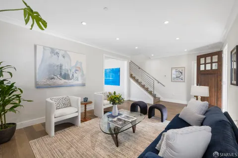 a view of a porch with furniture and garden