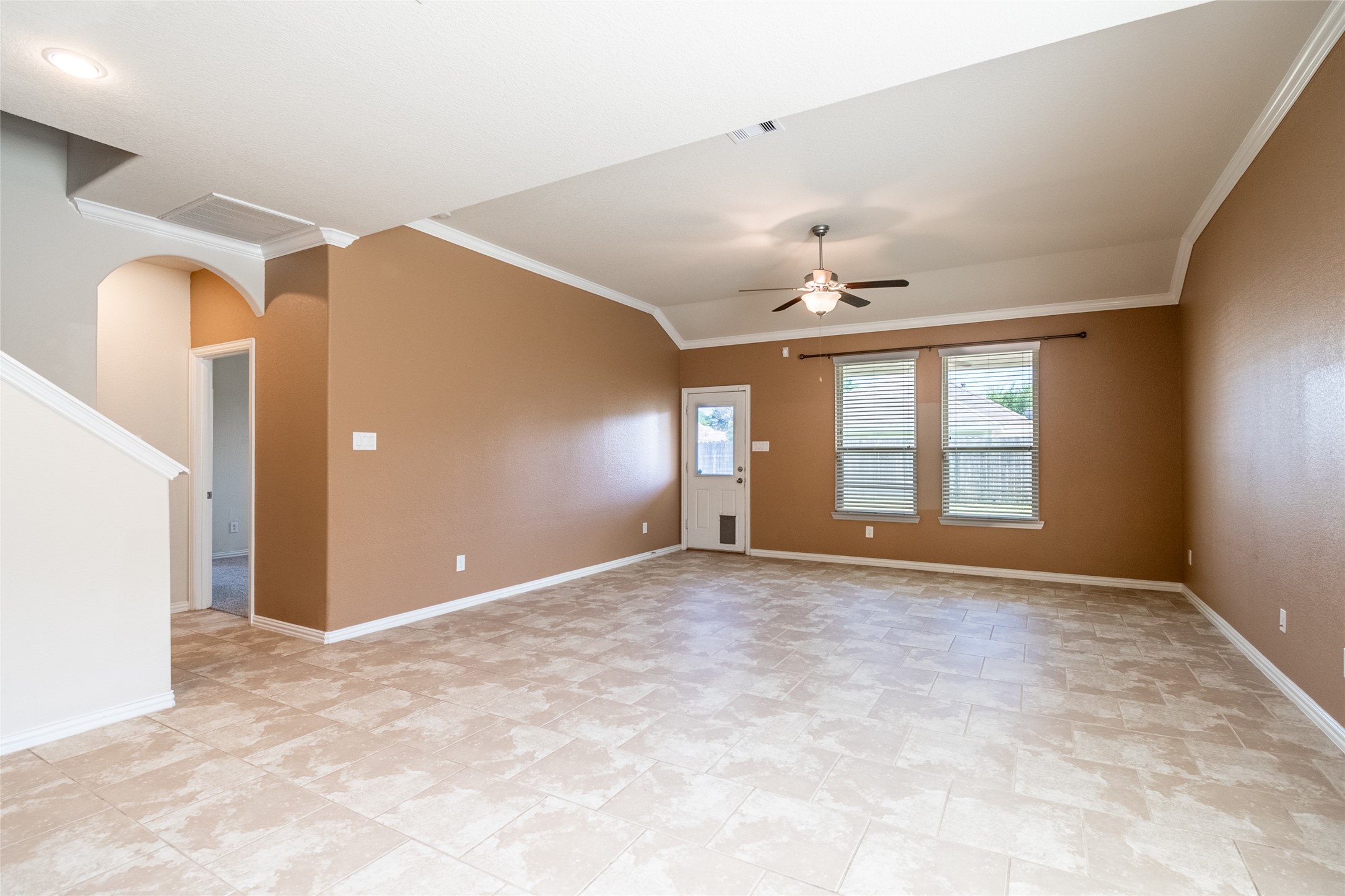 1610 Juniper Knoll Way Conroe, TX 77301 - Photo 11 of 41 an empty room with windows and ceiling fan