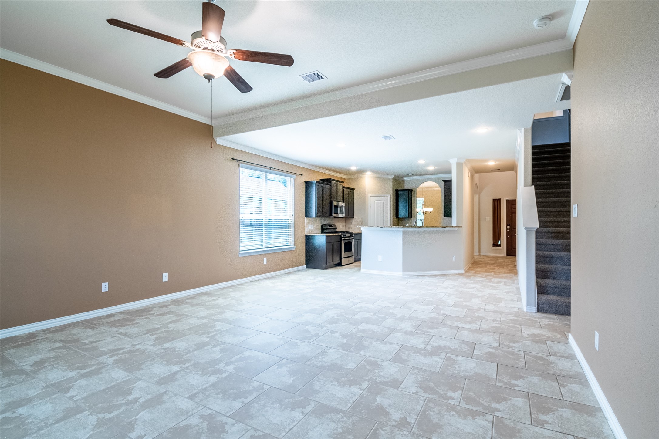 1610 Juniper Knoll Way Conroe, TX 77301 - Photo 13 of 41 a view of a kitchen with a sink and a microwave