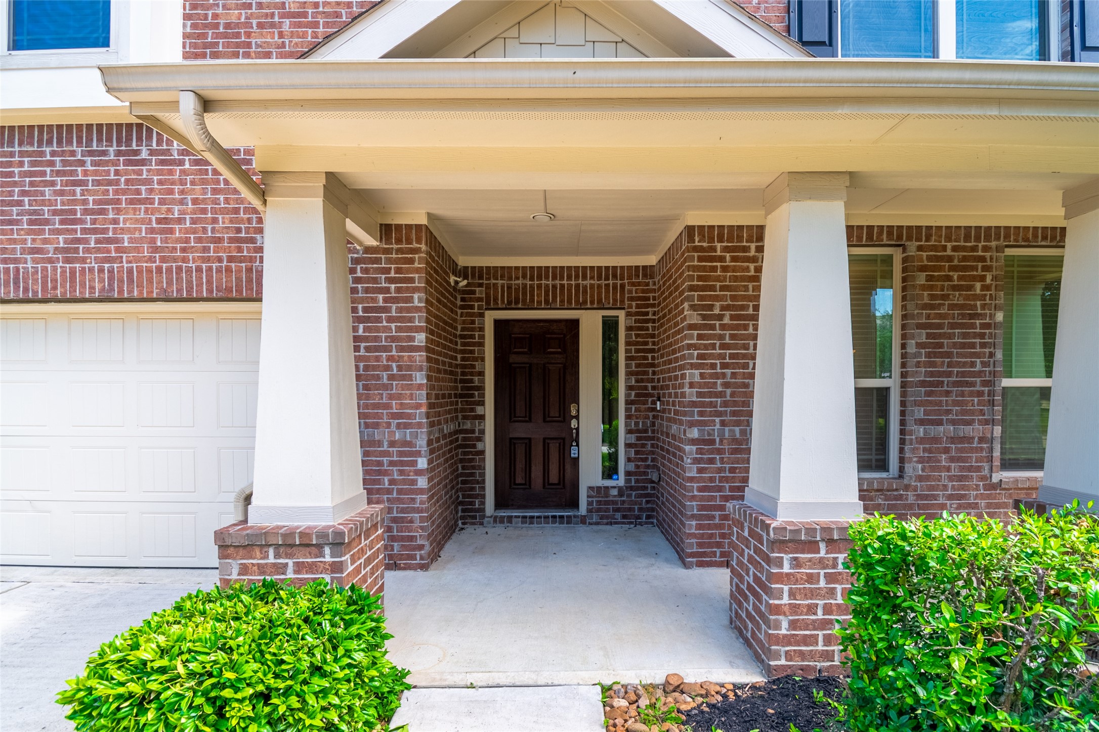 1610 Juniper Knoll Way Conroe, TX 77301 - Photo 2 of 41 a front view of a house with a large windows