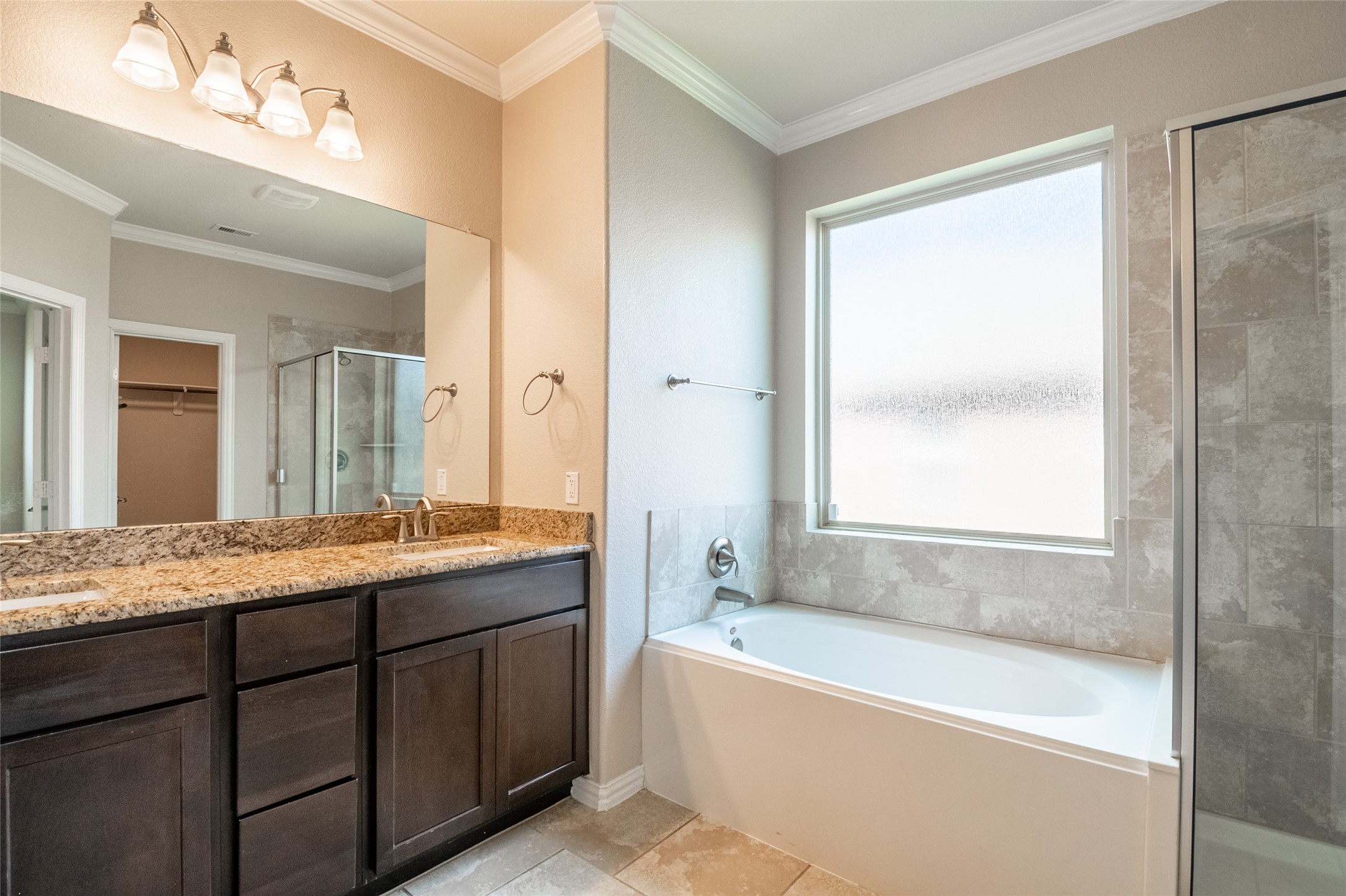 1610 Juniper Knoll Way Conroe, TX 77301 - Photo 22 of 41 a bathroom with a granite countertop bathtub sink vanity and mirror