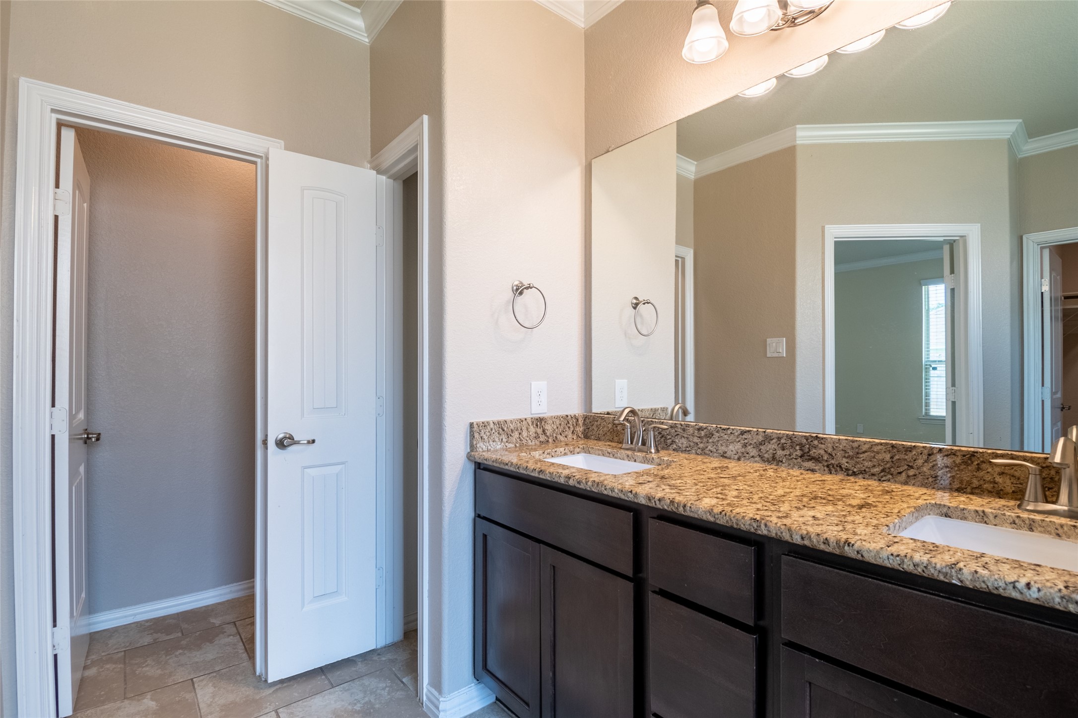 1610 Juniper Knoll Way Conroe, TX 77301 - Photo 23 of 41 a bathroom with a granite countertop sink and a mirror