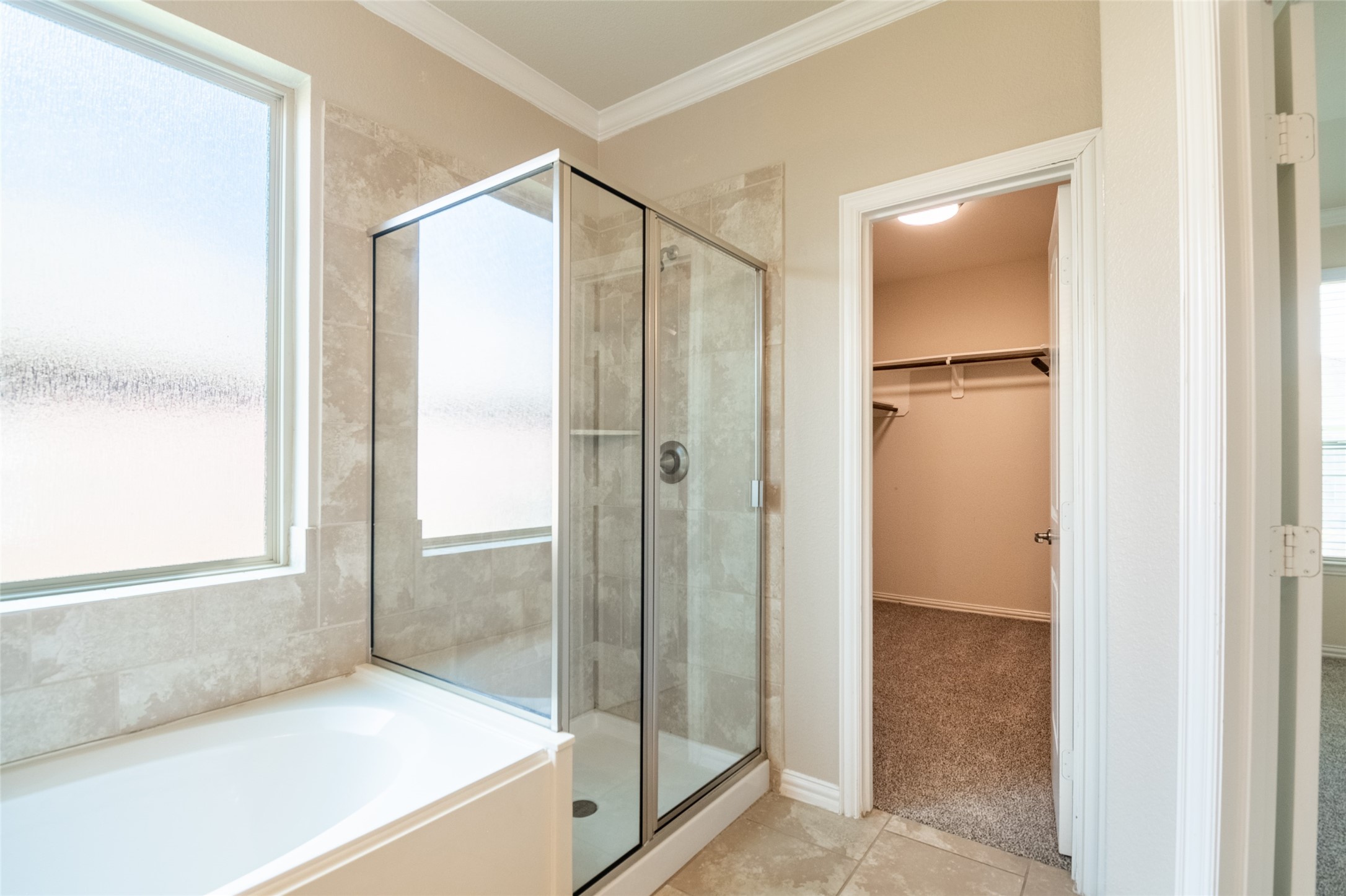 1610 Juniper Knoll Way Conroe, TX 77301 - Photo 24 of 41 a bathroom with a glass shower door