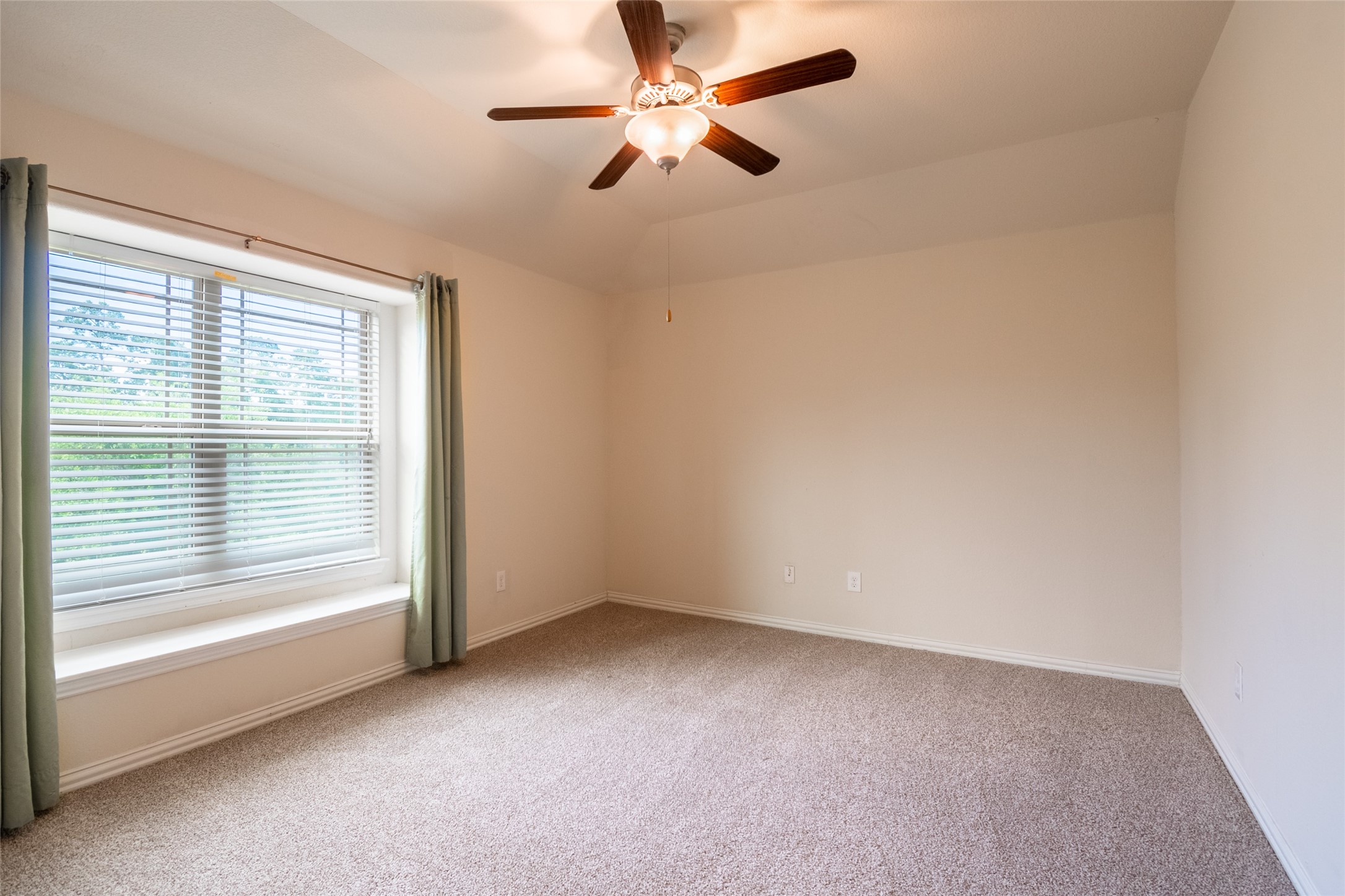 1610 Juniper Knoll Way Conroe, TX 77301 - Photo 29 of 41 a view of room with a ceiling fan and window