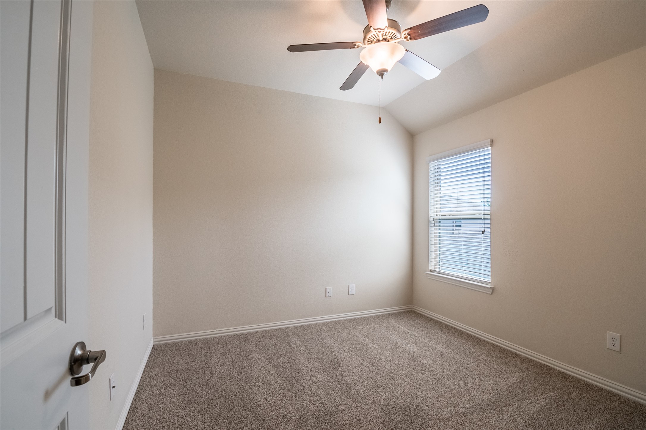 1610 Juniper Knoll Way Conroe, TX 77301 - Photo 33 of 41 an empty room with windows and fan