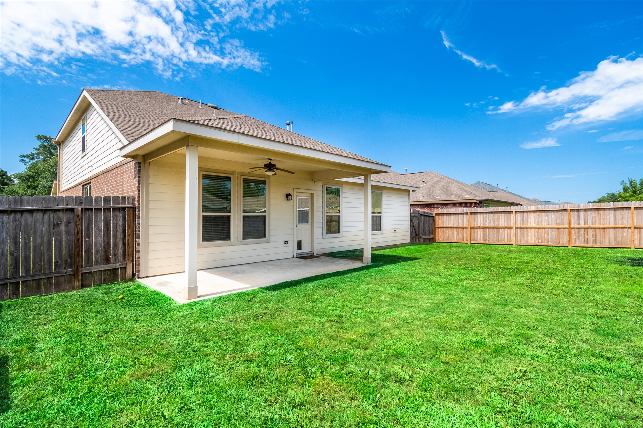 1610 Juniper Knoll Way Conroe, TX 77301 - Photo 39 of 41 a view of a backyard with plants and large trees