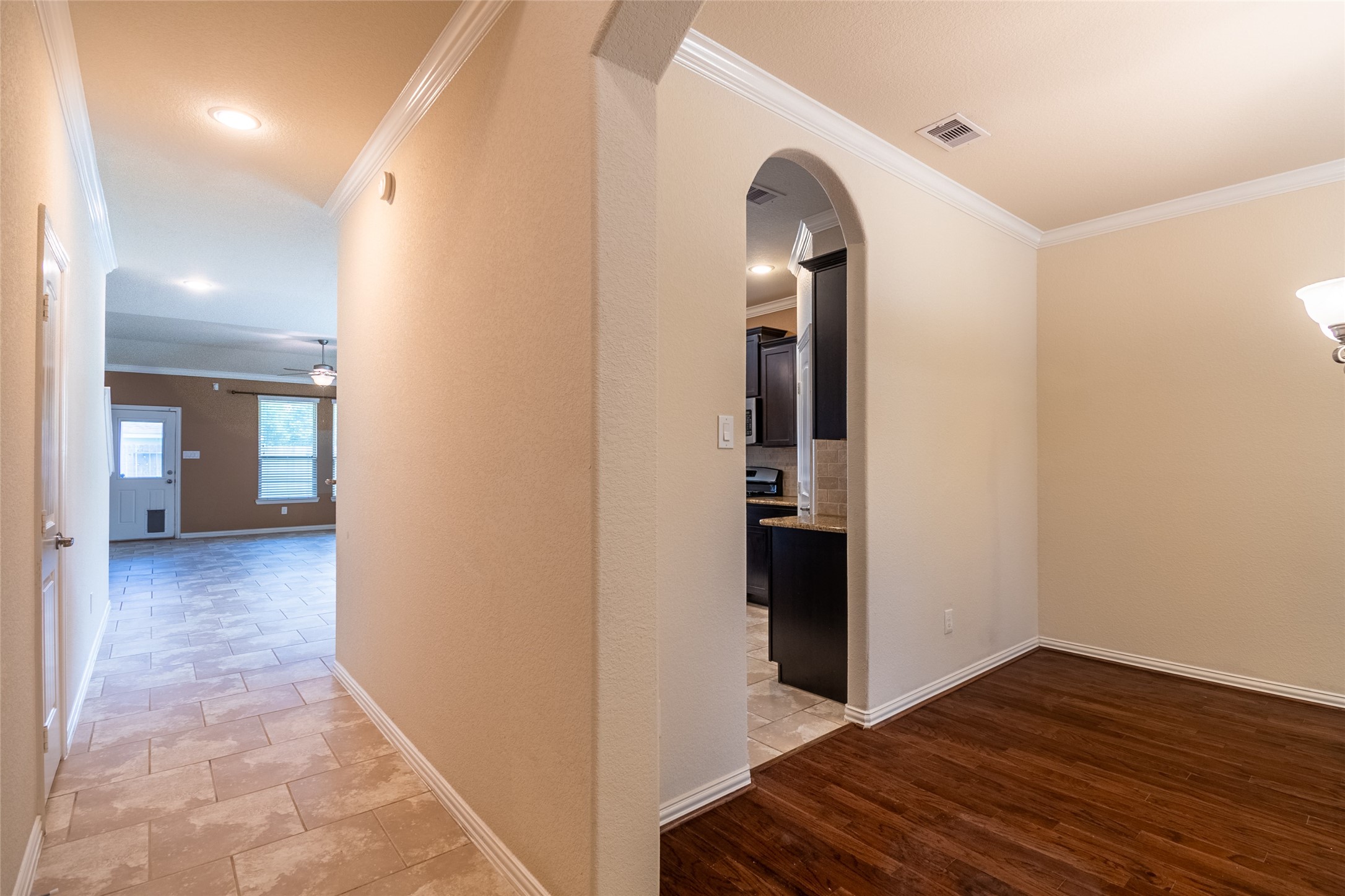 1610 Juniper Knoll Way Conroe, TX 77301 - Photo 5 of 41 a view of a hallway with wooden floor and staircase