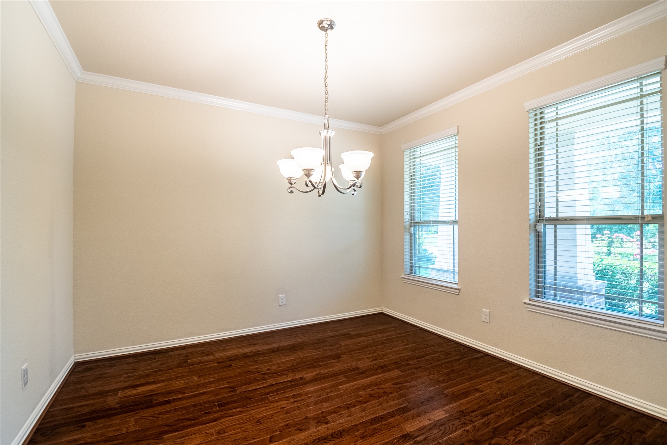 1610 Juniper Knoll Way Conroe, TX 77301 - Photo 7 of 41 a view of a room with wooden floor and windows