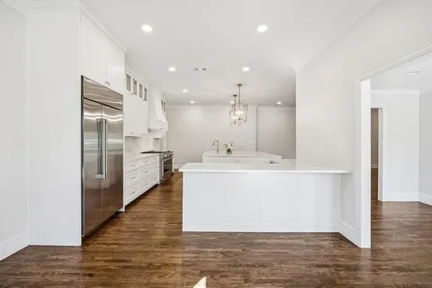 a bathroom with a sink double vanity and a mirror