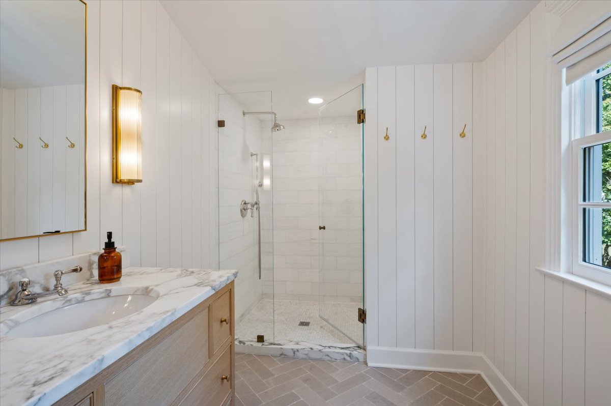 615 Ridge Road Kenilworth, IL 60043 - Photo 20 of 41 a bathroom with a granite countertop sink mirror and double