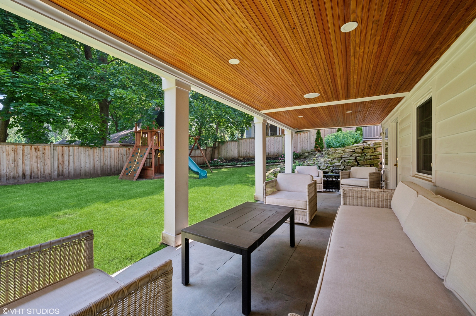 615 Ridge Road Kenilworth, IL 60043 - Photo 36 of 41 a view of a patio with a table chairs and a backyard