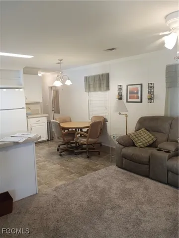 a spacious bathroom with a granite countertop sink and a mirror