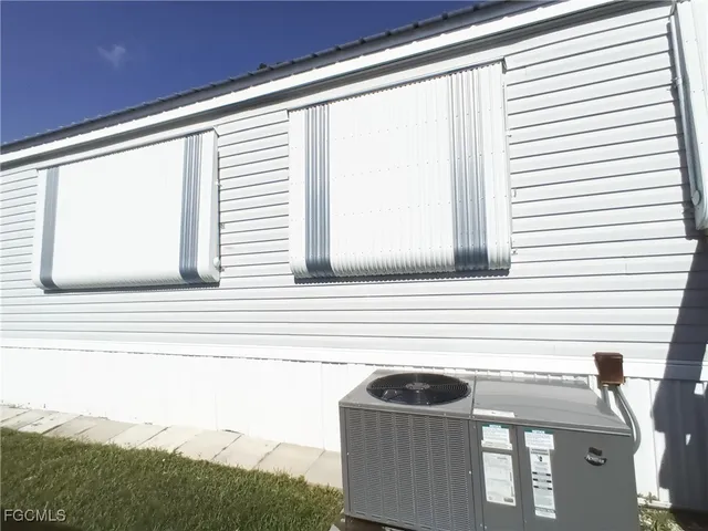 a kitchen with a refrigerator a stove a dining table and chairs