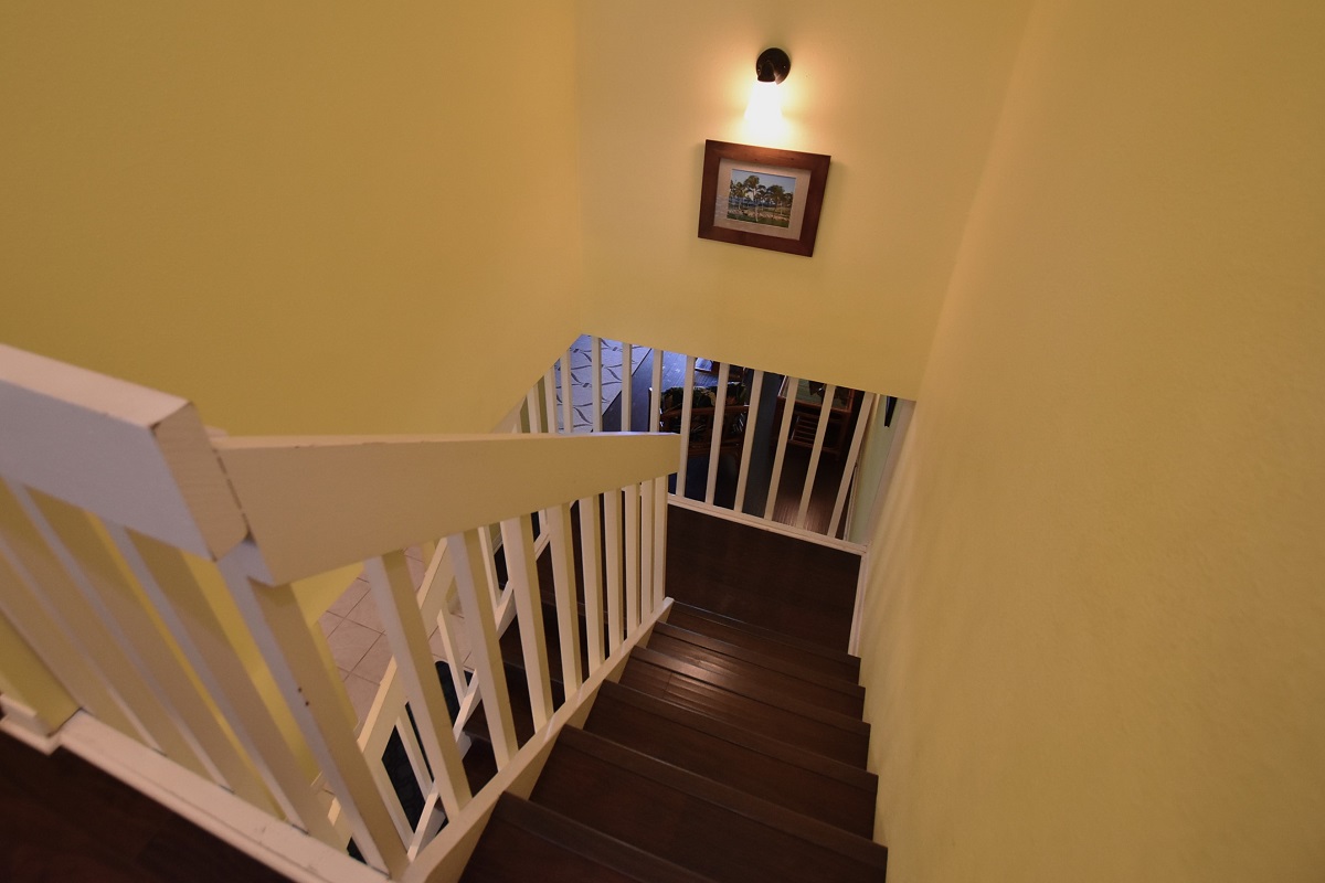 68-3840 Lua Kula Street, Unit D200 Waikoloa, HI 96738 - Photo 11 of 29 a view of a hallway with staircase
