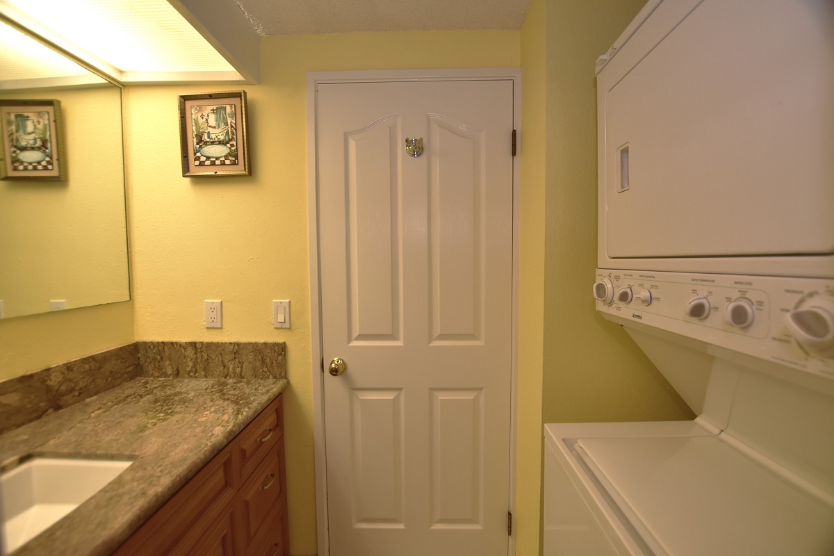 68-3840 Lua Kula Street, Unit D200 Waikoloa, HI 96738 - Photo 14 of 29 a view of a bathroom with a sink and a wooden floor