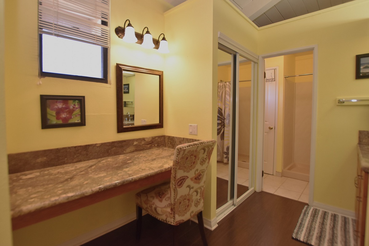 68-3840 Lua Kula Street, Unit D200 Waikoloa, HI 96738 - Photo 9 of 29 a bathroom with a granite countertop sink and a mirror