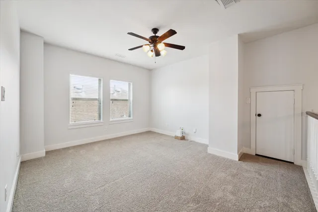 a bed room with a bed and a window