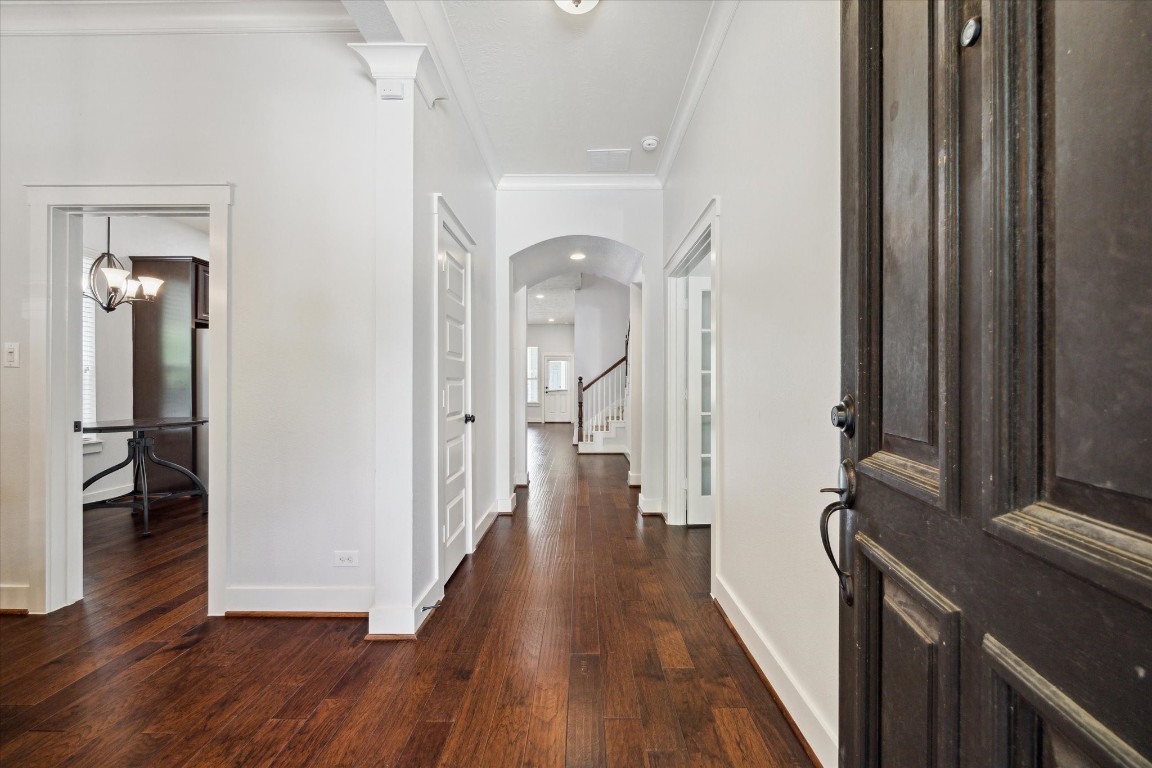 17011 Seminole Ridge Drive Cypress, TX 77433 - Photo 3 of 33 A welcoming entryway greets you with rich hardwood floors and crisp white walls giving the home a spacious and inviting feel.