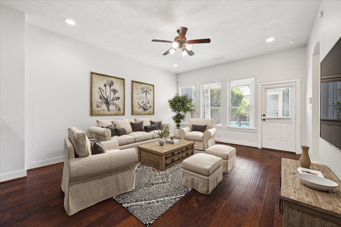 17011 Seminole Ridge Drive Cypress, TX 77433 - Photo 7 of 33 This living room features rich wood floors, recessed lighting, large windows with ample natural light, complementing the open layout. *Virtually Staged