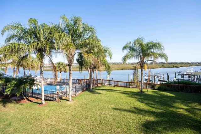 a view of a swimming pool with a table and chairs