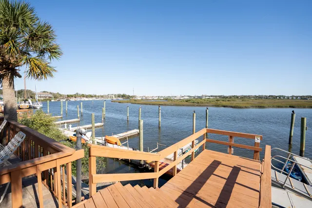 a view of a roof deck with lake and ocean view