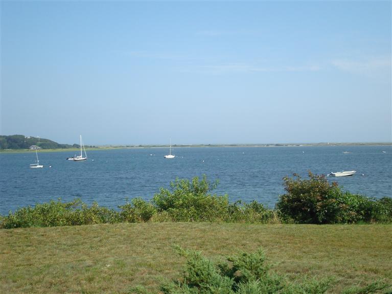 74 Sears Point Road Chatham, MA 02633 - Photo 6 of 21 a view of a field with an ocean
