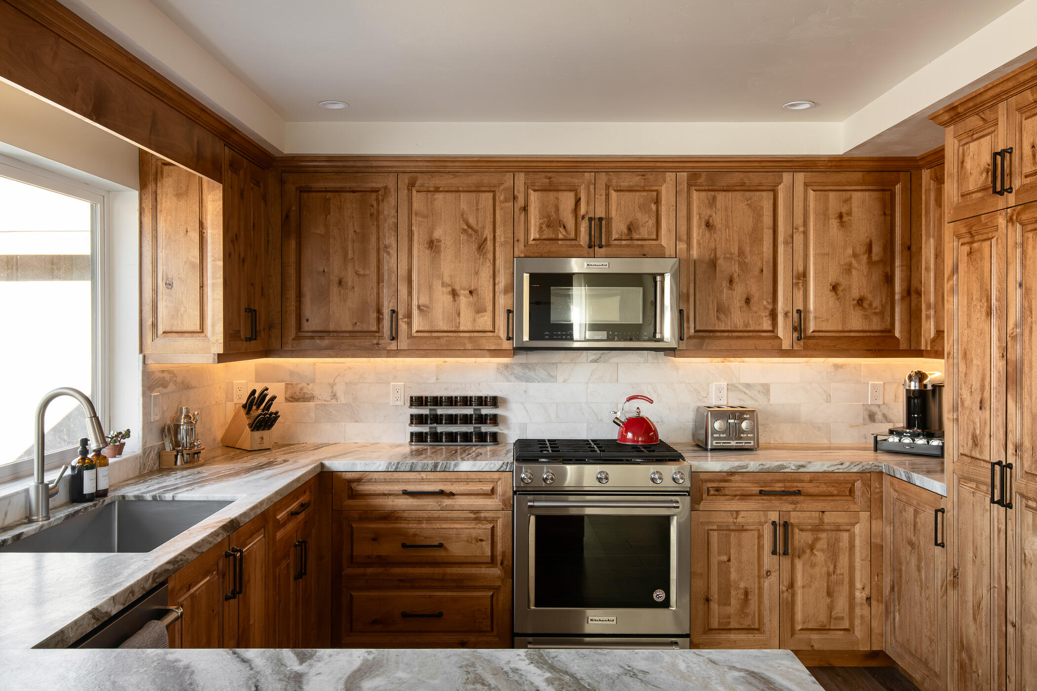 5544 Roy Rogers Road Pioneertown, CA 92268 - Photo 12 of 35 a kitchen with stainless steel appliances granite countertop a sink stove and microwave