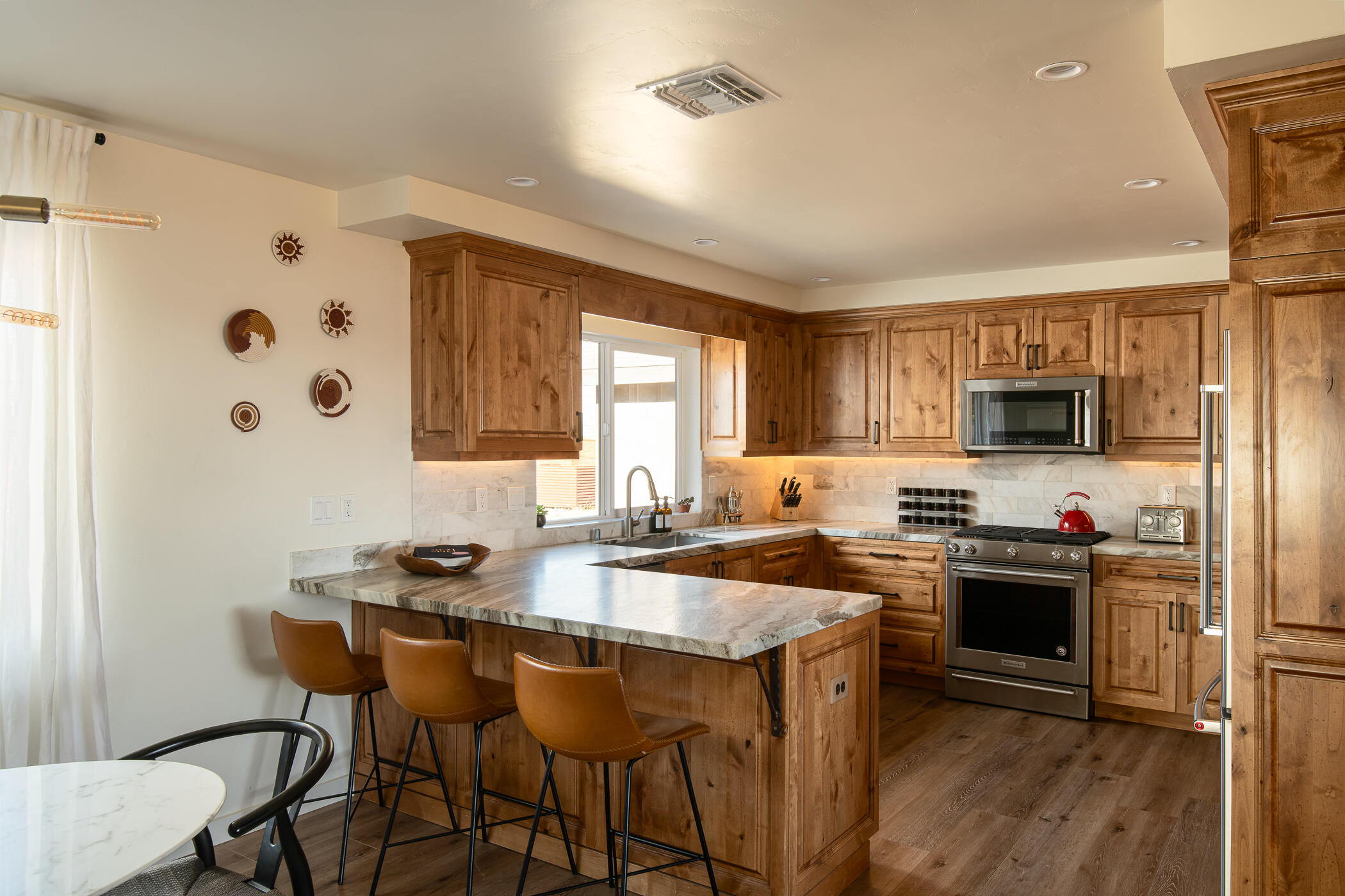 5544 Roy Rogers Road Pioneertown, CA 92268 - Photo 13 of 35 a kitchen that has a sink cabinets and stainless steel appliances