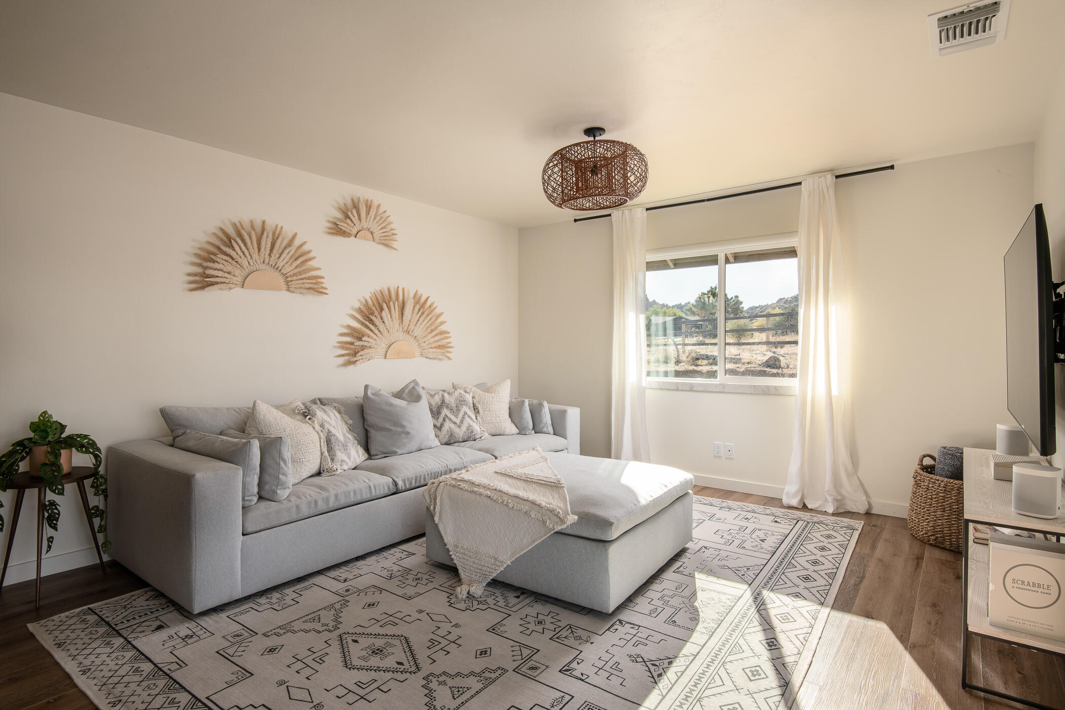 5544 Roy Rogers Road Pioneertown, CA 92268 - Photo 14 of 35 a spacious bedroom with a bed and a window