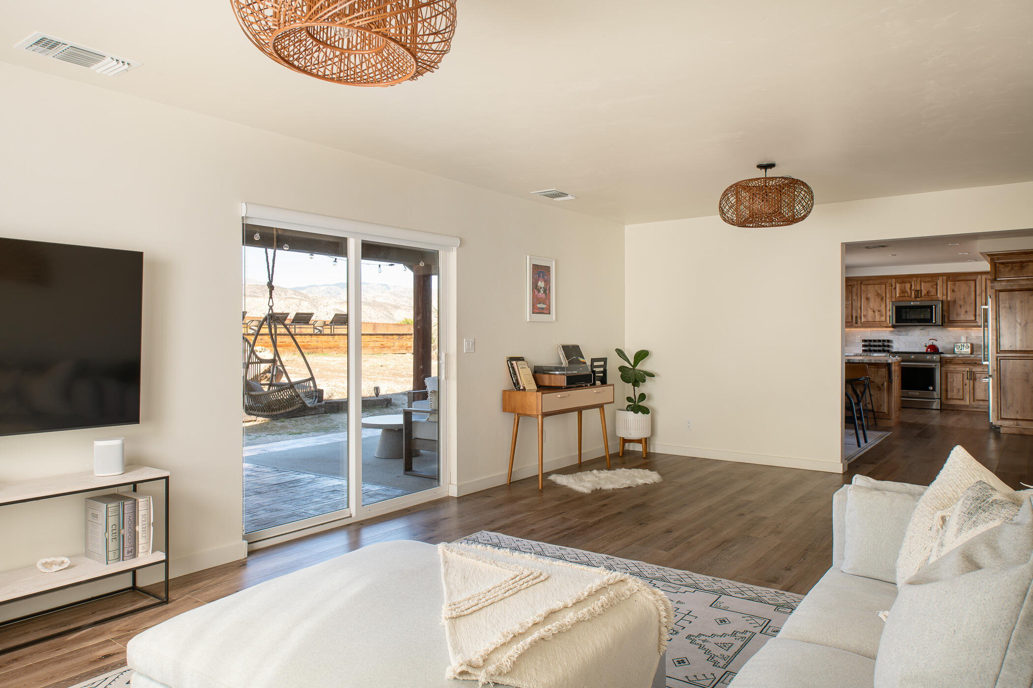 5544 Roy Rogers Road Pioneertown, CA 92268 - Photo 15 of 35 a living room with furniture and a flat screen tv