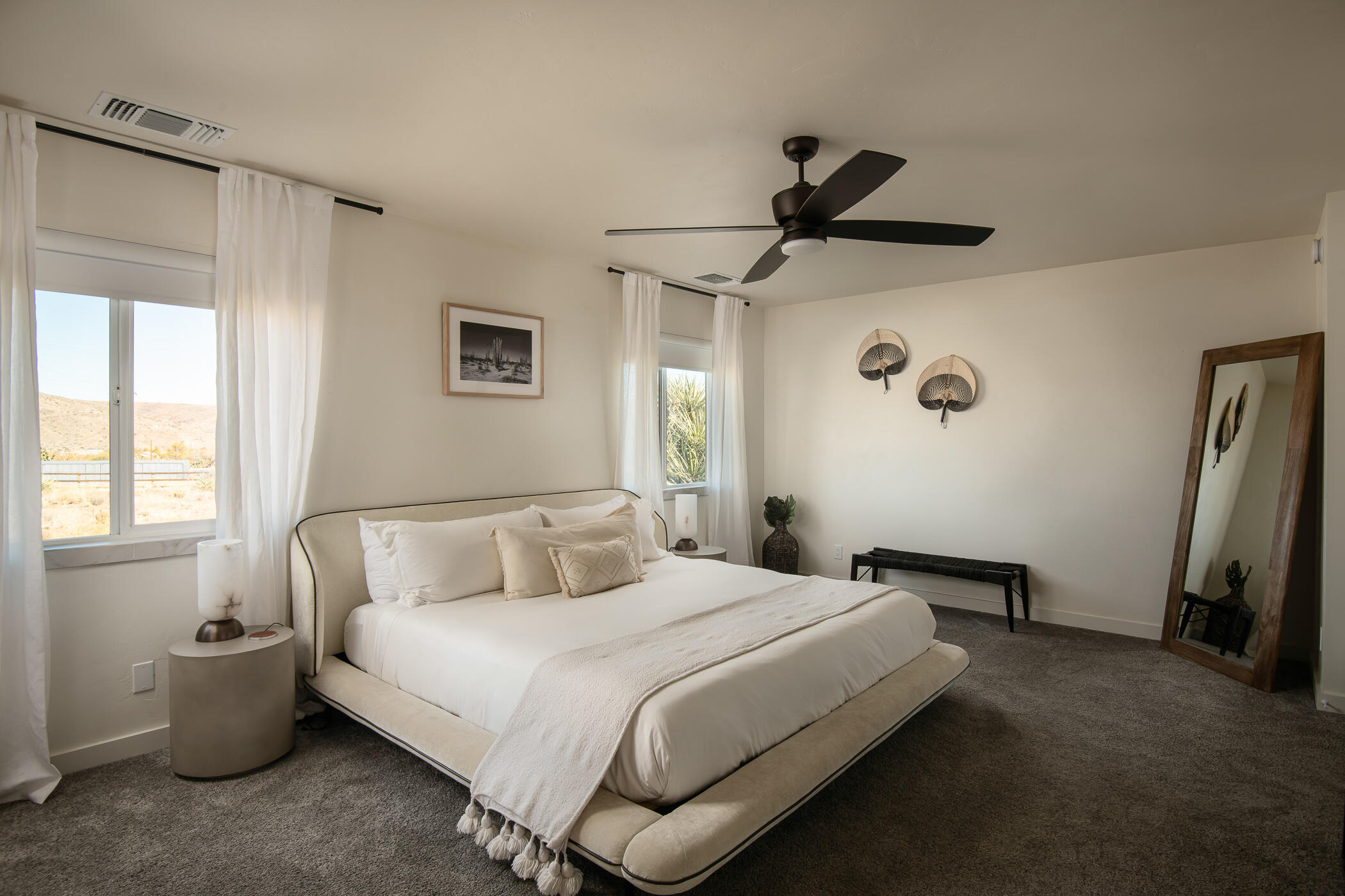 5544 Roy Rogers Road Pioneertown, CA 92268 - Photo 26 of 35 a bedroom with a bed and a window