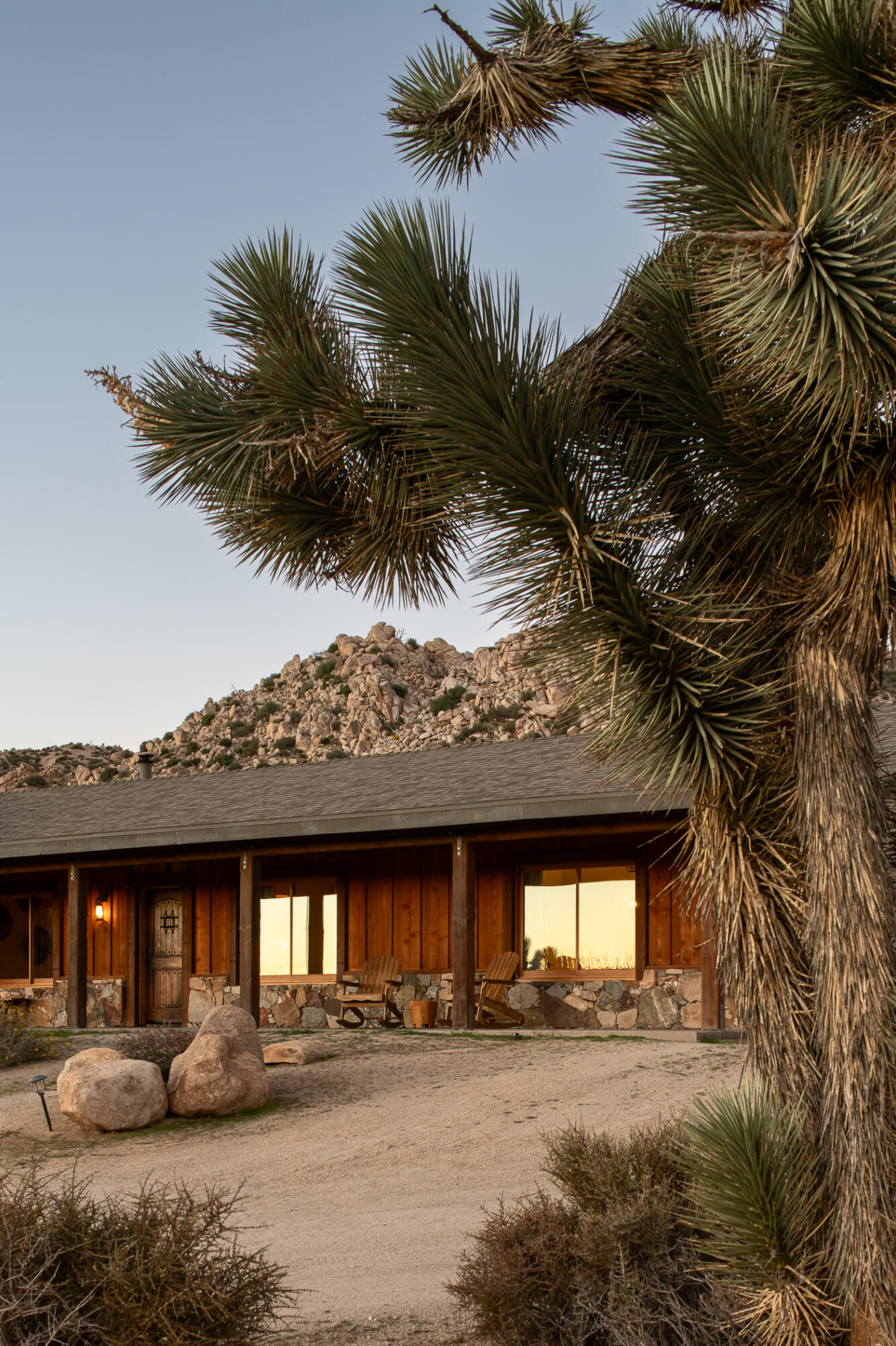 5544 Roy Rogers Road Pioneertown, CA 92268 - Photo 31 of 35 a front view of a house with a yard